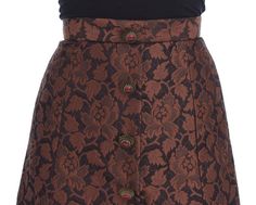 Dolce & Gabbana Skirt Gorgeous brand new with tags, 100% Authentic Dolce & Gabbana brown floral brocade skirt with silk stretch inner lining. This item comes from the exclusive MainLine Dolce & Gabbana Collection. Model: Above knee bubble skirt Color: Brown and black floral brocade Material: 54% Cotton, 34% Rayon, 12% Silk Antique gold with red stone buttons Back zipper and button closure Logo details, logo engraved hardware Made in Italy Luxury Fitted Brown Skirt, Brocade Skirt, Bubble Skirt, Dolce E Gabbana, Brown Floral, Red Stone, Dolce & Gabbana, Above Knee, Antique Gold