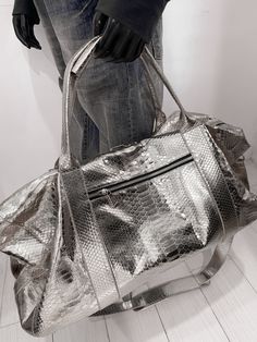 Indulge in the exquisite craftsmanship of our handmade SNAKESKIN Weekender/Duffle bag.  With a focus on premium quality, this travel companion boasts a removable shoulder strap for added convenience, making it equally appealing to both men and women. Dimensions: - Width: 55 cm/21.6 in - Height: 36 cm/14.1 in - Depth: 24 cm/9.4 in Inside, discover a thoughtfully designed interior with a handy zipper pocket. Our commitment to perfection is evident in the rigorous testing each new model undergoes a Luxury Large Capacity Pouch Shoulder Bag, Designer Large Capacity Shoulder Bag For Travel, Designer Travel Pouch Shoulder Bag, Luxury Rectangular Satchel With Large Capacity, Luxury Large Capacity Rectangular Satchel, High-end Rectangular Travel Satchel, High-end Satchel For Travel With Dust Bag, High-end Travel Satchel With Dust Bag Included, High-end Travel Satchel With Dust Bag