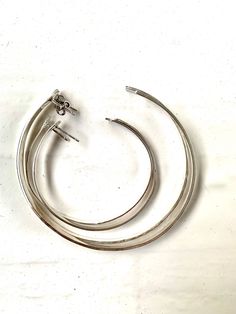 "Large Sterling Silver Hoops , Large Hammered Hoop Earrings Simple and stunning stud hoop earrings. They are lightweight and comfortable. They're the perfect classic Hoop! 3 sizes are now available - select from the drop down menu. Square wire is used and hammered down for a square effect. XL Hoops are 70mm/ 2 & 3/4\" in diameter. L Hoops / Diameter of the large Hoops is between 55-60mm. Small Hoops/ And diameter of small Hoops is around 45mm. Handmade in Australia free Shipping in Australia Modern Adjustable Hoop Wrap Earrings, Adjustable Modern Hoop Wrap Earrings, Hammered Hoop Earrings, Hammered Sterling Silver, Earrings Simple, Sterling Silver Hoop Earrings, Sterling Silver Hoops, Simple Earrings, Silver Hoops