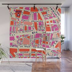 an orange and pink map wall mural in a living room