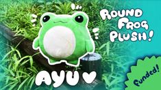 a green frog sitting on top of a lush green plant with the words round frog plush above it