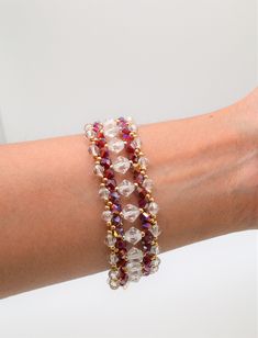 a woman's arm with two bracelets on it, one beaded and the other beaded