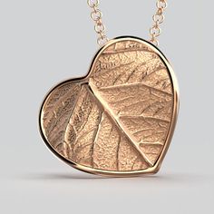 Elevate your style with our Italian 14k or 18k gold heart pendant and chain. Inspired by the beauty of nature, this exquisite heart pendant features a delicate leaf motif, infusing elegance and charm into every detail. Crafted with precision in Italy, this enchanting piece is a symbol of love and sophistication. A perfect accessory to cherish or to gift to someone special. 14k or 18k gold 20 mm high 20 mm large 18k Rolò chain chain length 45cm chain thickness 1.5mm designed and crafted in Italy Rose Gold Heart Pendant Necklace, Elegant Rose Gold Leaf Jewelry, Elegant Rose Gold Leaf-shaped Jewelry, Nature-inspired Rose Gold Pendant Necklace, Nature-inspired Rose Gold Necklace, Elegant Sterling Silver Leaf-shaped Necklace, Elegant Rose Gold Heart Necklace With Round Pendant, Elegant Rose Gold Heart Pendant Necklace, Rose Gold Heart Pendant Jewelry With Polished Finish