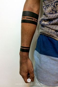 a man with a tattoo on his arm