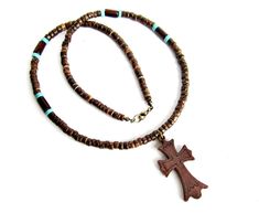 Necklace for men with carved wooden cross pendant, coconut beads turquoise howlite stone beads. Mens cross necklace, religious jewelry for him. Brown turquoise necklace for men, wood and coconut beaded necklace. Gift for him. Necklace length: 23 inches (58 cm) Coconut beads: 6 mm Turquoise howlite stone beads: 6 x 3 mm Wooden cross pendant: 45 x 24 mm For all products are used only genuine high-quality Italian leather, natural stones and wood. All metal materials are lead and nickel free. /Gift Brown Bohemian Cross Necklace, Bohemian Brown Cross Necklace, Handmade Brown Crucifix Jewelry, Brown Crucifix Necklace In Spiritual Style, Brown Spiritual Necklace With Cross Pendant, Spiritual Brown Crucifix Necklace, Spiritual Brown Cross Necklace, Brown Wooden Beads Cross Necklace, Brown Cross Necklace With Wooden Beads