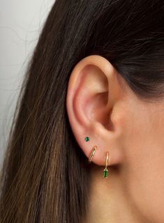 "The tiniest little studs for the most understated sparkle. Simple and dainty, they're perfect for layering with other dainty hoops and studs when you have multiple piercings. ∙ Available with emerald green, blue or purple cz stones. All options are available on the dropdown menu. ∙ Sold individually (1 stud) or by pair (2 studs) PLEASE NOTE - These are very tiny. * D E T A I L S * ∙ Material:  .925 Sterling Silver or 18K Gold Plated over .925 Sterling Silver  ∙ Stone: Green, Blue or Purple cz s Stacked Lobe Ear Piercings Simple, Earring Two Holes, Blue Ear Piercings, Third Hole Piercing, Tiny Dangle Piercings As Gift, Tiny Dangle Piercings For Gift, Minimalist Everyday Huggie Earrings With Birthstone, Dainty May Birthstone Earrings, Minimalist Huggie Birthstone Earrings