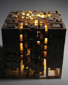 a wooden box with some lights in it's center and the lid lit up