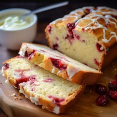 a loaf of cranberry bread on a cutting board