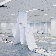 an empty room with white walls and floor coverings on the ceiling is pictured in this image