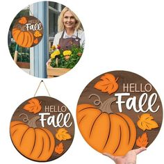 two pumpkins hanging from the side of a door with hello fall written on them