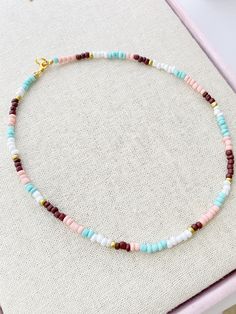 Seed Bead Choker Necklace 17 inches total length Perfect for layering with your favorites Glass Beads with Gold plated lobster clasp closure These little seed beads are 4mm wide A short extender tail will be added so you can adjust the length a little if you like Trendy Beaded Necklace With Colorful Turquoise Beads, Trendy Turquoise Necklace With Round Beads, Trendy Turquoise Beaded Necklace, Trendy Turquoise Beaded Necklaces With Round Beads, Trendy Turquoise Round Beaded Necklace, Trendy Turquoise Round Beads, Minimalist Multicolor Beaded Chain Necklace, Trendy Handmade Turquoise Beaded Necklaces, Trendy Turquoise Beaded Necklaces For Gifts