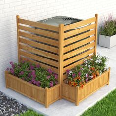 two wooden planters with flowers in them on the side of a building next to a brick wall