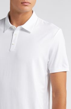 This polished take on the polo is crafted from lightweight lyocell jersey with added stretch to retain its shape. 26" length (size medium) Button half-placket Spread collar Short sleeves 93% Tencel® lyocell, 7% spandex Tencel lyocell is a sustainably produced fiber made with closed-loop processing Dry clean or machine wash, tumble dry Imported Fitted Polo Shirt With Seamless Collar, Fitted Collared Polo Shirt For Business Casual, Fitted Polo Shirt For Business Casual, Classic Polo Collar Tops With Stretch, Classic Stretch Polo Shirt, Stretch Cotton Collared Polo Shirt, Classic Stretch Polo Shirt In Solid Color, Fitted White Button-up Polo Shirt, Fitted Polo Shirt With Button Closure For Business Casual