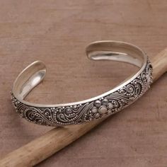 Sterling Silver Swirl Motif Cuff Bracelet from Bali - Shrine Swirls | NOVICA Luxury Carved Bracelets For Wedding, Luxury Carved Antique Silver Jewelry, Luxury Handmade Ornate Sterling Silver Bracelet, Luxury Antique Silver Bracelets With Intricate Design, Beautiful Bracelet Novica, Sterling Silver Bracelets Novica, Luxury Handmade Antique Sterling Silver Bracelet, Luxury Antique Silver Artisan Jewelry, Luxury Elegant Antique Silver Sterling Bracelet