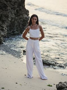 Designed to look and feel like a custom fit, the 100% Turkish cotton Pera Pants White have been crafted from comfy and breathable cotton. Boasting an unlined, wide-leg silhouette, binding on the front seams, the cotton Pera Pants are high-waist to flatter the figure and cut a dramatic shape. - 100% Turkish thick cotton - Hidden front closure - Side pockets - Zipper - Front seams with wide-leg cut silhouette - High-waist, elasticated back Straight Cotton Pants For Vacation, Cotton Straight Pants For Vacation, Vacation Straight Cotton Pants, Cotton Wide Leg Ankle-length Pants For Beach, Cotton High-waisted Wide Leg Pants For Vacation, Cotton Ankle-length Wide Leg Pants For Beach, Vacation Cotton High-waisted Wide Leg Pants, Vacation High-waisted Cotton Wide Leg Pants, Cotton Trousers For Vacation