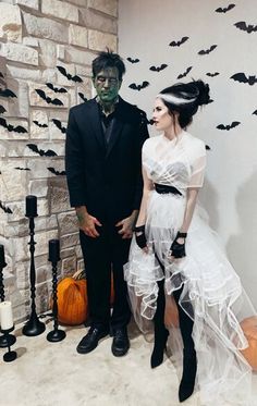 a man and woman dressed up in halloween costumes