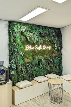 an office with a green wall and coffee machine