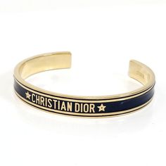 Used Christian Dior Bangle - Navy Gold Metal Bracelet For Women (Sku: Gzl1390c) === General === Brand : Christian Dior === Design === Type : Bangle Gender : Women Material : Metal Color : Gold, Navy === Size === Length : 14.5cm / 5.7'' === Included Items === Accessories : None Accessories Notice : Before Purchasing, Please Refer To The Images Of The Accessories Included With The Item. === Condition === Condition : Used (Good) Ranking : Rank Ab Used - Traces Of Usage, Scratches / Dirt Can Be Seen Dior Cd Navy Bracelet, Christian Dior Jadior Bracelet, Dior Bracelet Gold, Navy Gold, Metal Bracelets, Luxury Branding, Christian Dior, Gold Metal, Dior