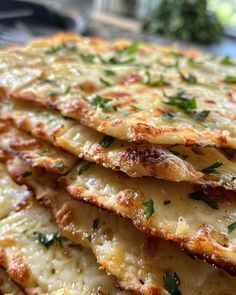 closeup of cheesy bread with parsley on top