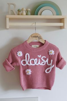 🤍 The perfect personalised sweater for your little love or a fantastic personalised gift  🤍 100% handmade designs with care and attention put into every sweater. Choose personalised wording or name with the optional addition of flowers, hearts or bumblebees. Message if you would like such additions 🤍 Colours may vary slightly due to screen settings and lighting. 🤍 Care Instructions - Turn the sweater inside out and Machine Wash or Hand Wash. Air Dry Naturally. Shipping  *Please note that the Personalized Cotton Sweater For Winter, Personalized Pink Long Sleeve Sweater, Cute Pink Letter Print Sweater, Cute Pink Sweater With Letter Print, Personalized Pink Crew Neck Sweater, Personalized Pink Sweater For Winter, Customizable Cute Winter Sweater, Cute Customizable Winter Sweater, Customizable Long Sleeve Sweater For Gift