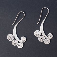 Sterling silver spiral earrings Approximate dimensions; L 2.5 X W 1.25 inches Handmade Silver Swirl Earrings, Nickel Free Silver Swirl Earrings, Unique Silver Spiral Earrings, Unique Spiral Silver Earrings, Unique Sterling Silver Swirl Earrings, Unique Silver Spiral Wrap Earrings, Sterling Silver Swirl Earrings, Silver Swirl Sterling Silver Earrings, Unique Silver Swirl Earrings