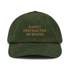 🎉 "Easily Distracted by Rocks" Embroidered Corduroy Hat 🪨✨ A hat made of corduroy? That's a yes! Our "Easily Distracted by Rocks" embroidered corduroy hat is the ultimate accessory for geology enthusiasts, nature lovers, and anyone who can't resist the allure of a cool rock. Whether you're a student, a seasoned geologist, or just love exploring the great outdoors, this hat is a fun and stylish way to show off your passion. Key Features: 🪨 100% Cotton Corduroy: Enjoy the softness, durability, Easily Distracted By Rocks, Funny Hats For Women, D&d Gifts, Nature Clothes, Fun Hats, Embroidered Corduroy, Silly Hats, Corduroy Hat, Funny Hats