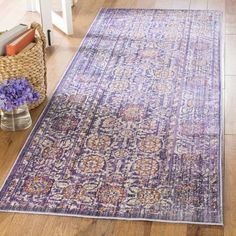 a purple rug on the floor in a living room