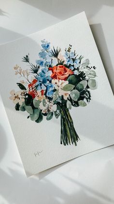 a bouquet of flowers sits on top of a white card with watercolors and ink