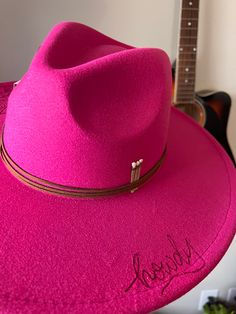 Make a statement with the Howdy hat! This hot pink, dolly parton inspired style is the perfect way to introduce some western flair into your wardrobe. The unique howdy detail will make sure you stand out in a crowd! The hot pink howdy hat is the perfect addition to your western wardrobe Pink Adjustable Fedora Felt Hat, Trendy Felt Hat For Country Events, Adjustable Pink Fedora Felt Hat, Pink Adjustable Fedora With Curved Brim, Pink Brimmed Felt Hat, Adjustable Pink Fedora With Curved Brim, Pink Fitted Brimmed Felt Hat, Fitted Pink Brimmed Felt Hat, Pink Adjustable Curved Brim Fedora