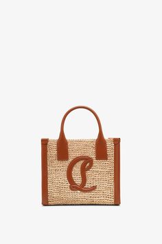 Brown raffia tote bag from Christian Louboutin. The By My Side mini tote bag is made of woven raffia with an open top, finished with a leather CL logo motif. It has two top handles, complete with an adjustable and removable shoulder strap.Measurements: L23 x H20 x W9cmMade in Italy Cl Logo, Raffia Tote Bag, Woven Raffia, Mini Tote Bag, Mini Tote, My Side, Open Top, Christian Louboutin, Shoulder Strap