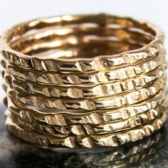 Our Coin-Edge Hammered Yellow Gold-filled stacking ring is entirely hand-made & mixes well with most of the items in our store. YOU WILL RECEIVE: * Seven 16g Coin Edge hammered Yellow Gold-filled rings 7 rings total! * Made with: 16g (1.29 mm) 12k Yellow Gold-filled wire. * When stacked, they measure at just over half an inch. * We do make 1/2 & 1/4 sizes, just leave a note with your size preference. * All of our items are entirely hand crafted and have a standard processing time of 3-5 Hammered Recycled Gold Stackable Rings, Hammered Stackable Rings In Recycled Gold, Stacked Round Rings As Gift, Stackable Bands In Recycled Gold, Stacked Rings In 14k Gold As Gift, Stacked Round Rings For Anniversary, Stacked 14k Gold Rings For Gift, Stacked 14k Gold Rings As Gift, Stacked Yellow Gold Rings As A Gift