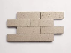 a white brick wall that has been made out of bricks and placed on top of each other