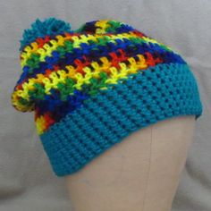 Hand Crafted Rainbow & Teal Color Block With Teal Pom Pom Cozy Warm Acrylic Beanie Hat New With Tags - Designed & Handcrafted By Me Alex 8 Colorful Rainbow Color Block With Teal Pom Pom Perfect For Dopamine Dressing Cold Weather Essential Item For Cozy Warmth & Comfort Hat Can Be Worn Snug To The Head Or Semi Slouchy High Quality 100% Acrylic - Some Stretch One Size Fits Most Youth To Adult Hand Made In The Usa Hand Or Machine Wash Cold Gentle Cycle, Dry Flat Or Tumble Dry Warm Approximate Relax Blue Casual Beanie One Size Fits Most, Blue Casual Beanie One Size, Casual Blue Beanie, One Size Fits Most, Casual Multicolor Beanie For The Beach, Colorful Crochet Casual Hats, Casual Multicolor Beanie For Beach, Blue Winter Beanie, Blue Casual Beanie, Casual Multicolor Beach Beanie