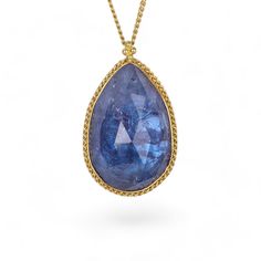 Tanzanite necklace on white Teardrop Tanzanite Jewelry In Yellow Gold, Yellow Gold Briolette Sapphire Necklaces, Formal Briolette Sapphire Necklace, Gold Tanzanite Pendant Necklace, Gold Tanzanite Teardrop Jewelry, Gold Necklaces With Sapphire And Gemstone Accents, Yellow Gold Tanzanite Oval Necklace, Gold Teardrop Sapphire Necklace, Gold Necklaces With Briolette Sapphire