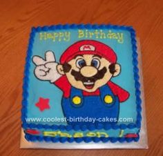 a birthday cake that looks like mario the super mario bros character is on top of a wooden table