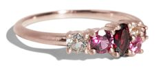 three stone ring with pink and white diamonds