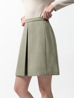 Composition : 60% polyester / 25% acrylic / 15% rayonCountry of Origin : Republic of Korea Elegant Pleated Skort For Winter, Elegant Pleated Winter Skort, Chic Green Pleated Workwear Skirt, Chic Green Pleated Skirt For Work, Elegant Winter Skort With Lined Skirt, Elegant Winter Lined Skort, Chic Short Winter Skirt, Chic Green Pleated Skirt For Fall, Elegant A-line Spring Skort