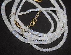 Item Descripton Narural White Moonstone Rondelle Smooth Beads Necklace Size: 6X3 MM Shap:Beads Natural White Moonstone Necklace White Jewelry With Oval Natural Stones, White Jewelry With Natural Oval Beads, White Gemstone Necklaces With Round Beads, White Jewelry With Natural Oval Stone Beads, Elegant White Moonstone Beaded Necklaces, Elegant White Moonstone Beaded Necklace, White Rondelle Spacer Bead Necklaces, White Necklace With Oval Gemstone Beads, White Rondelle Necklace With Spacer Beads