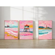 three colorful paintings on the wall in an empty room with wood flooring and white walls