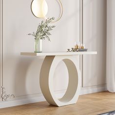 a white table with a vase on top of it next to a mirror and lamp