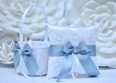 two blue and white wedding garters sitting next to each other