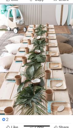 a long table with plates and cups on it