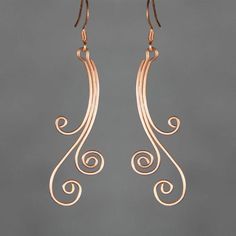 The scroll hoop earrings are handmade using copper wire. Free US shipping Customers who purchased this item said: Love this artist and her designs Beautiful design, eloquent and simply goes with most outfits. They are light therefore no pulling down on the earlobe. I have received lots of Wire Jewelry Earrings, Wire Jewelry Patterns, Wire Wrapped Jewelry Diy, Wire Jewelry Designs, Earrings Bridesmaid, Diy Wire Jewelry, Wire Work Jewelry, Work Jewelry, Handmade Wire Jewelry