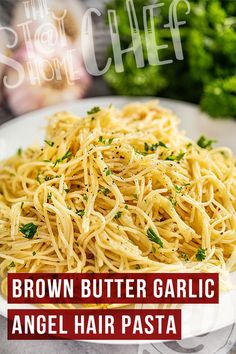 brown butter garlic angel hair pasta on a white plate with parsley in the background