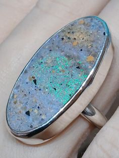 One of a kind, handcrafted, Louisiana Opal and sterling silver ring, Size  10(one free sizing). Top measures about 38mm X 19mm. Unique Handmade Silver Opal Ring, Unique Silver Opal Ring With Natural Inclusions, Handmade Unique Silver Opal Ring, Handmade Iridescent Sterling Silver Ring, Silver Handmade Opal Ring Collectible, Sterling Silver Opal Ring With Natural Inclusions, Silver Opal Ring With Natural Inclusions In Sterling Silver, Handcrafted Rings, Ring Jewelry