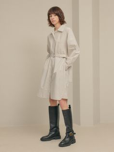 Editor's notesIt is a shirt dress inspired by trench coat design. The dress features a belt, hidden button, top-stitching point, pockets on the front, and side slits. It is a refreshing dress made of cotton fabric.- Relaxed fit- Trench coat design- Top-stitching point- Side slits- 100% CottonMeasurements(in.)One Size- Shoulder: 21.3 in.- Chest: 22.8 in.- Hem: 24.6 in.- Sleeve Length: 20.3 in.- Sleeve: 9.1 in.- Front Length: 39.4 in.- Back Length: 40.9 in.*Model info- Height 5’ 9” Bust 34” Waist Chic Workwear Shirt Dress With Roll-up Sleeves, Spring Shirt Dress With Belted Cuffs And Spread Collar, Spring Shirt Dress With Belted Cuffs, Chic Shirt Dress With Roll-up Sleeves For Work, Fall Workwear Shirt Dress With Belted Cuffs, Spring Workwear Shirt Dress With Belted Cuffs, Classic Shirt Dress With Pockets For Spring, Workwear Shirt Dress With Spread Collar And Roll-up Sleeves, Chic Shirt Dress With Roll-up Sleeves For Office