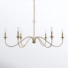 a brass chandelier with five lights hanging from it's center and four arms