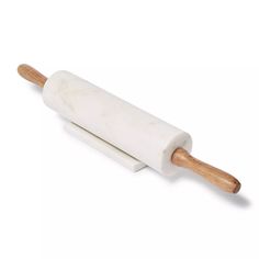 a white rolling pin with wooden handle on a white background, isolated for use in baking or pastry making