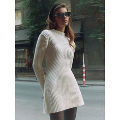 Discover Timeless Elegance Embrace your unique style with our latest addition, the Elegant Knitted O-Neck Mini Dress. Perfect for the fashion-forward woman, this dress blends comfort and elegance, making it a must-have in your autumn/winter wardrobe. Its sleek, ribbed design and long sleeves offer a chic, sophisticated look that's both versatile and timeless. Features That Define Style Material Composition: Crafted with high-quality synthetic fibers, offering durability and ease of care. Chic O- Knitted Dresses For Women Winter, White Stretch V-neck Sweater Dress, Chic Knitted V-neck Sweater Dress, Chic Knitted V-neck Dresses, Chic Knit Mini Dress, Chic Knitted Sweater Dress In Mini Length, Chic Knitted Mini Sweater Dress, Chic Knitted Mini Dress, Chic Knee-length Ribbed Mini Dress