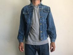 "Vintage Denim Pleated Jacket Buckaroo by Big Smith Made in USA 1950s Denim jacket in washed blue indigo . Nice patina. Sanforized Typical pleats on frond 6 snap-buttons front . Buttoned cuffs. All buttons are signed Big Smith. Double chest-pockets and lower pockets. Horseshoes stitching on the chest pockets. Label inside and on left low pocket. Vintage item in good condition. 100% Cotton Estimated size: M. Size on tag: 38. Our women model in the photos wears usually size S and measures 170cm/ 6 Vintage Pre-washed Medium Wash Denim Jacket, Vintage Pre-washed Denim Blue Outerwear, Vintage Faded Pre-washed Outerwear, Vintage Faded Outerwear With Pockets, Vintage Faded Denim Outerwear, Vintage Washed Denim Jacket, Faded Denim Vintage Outerwear, Faded Vintage Denim Outerwear, Vintage Light Wash Outerwear With Pockets